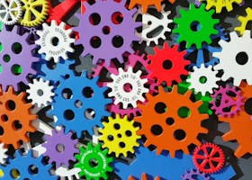 A colorful arrangement of gears symbolizing creativity, innovation, and machinery in vibrant colors.
